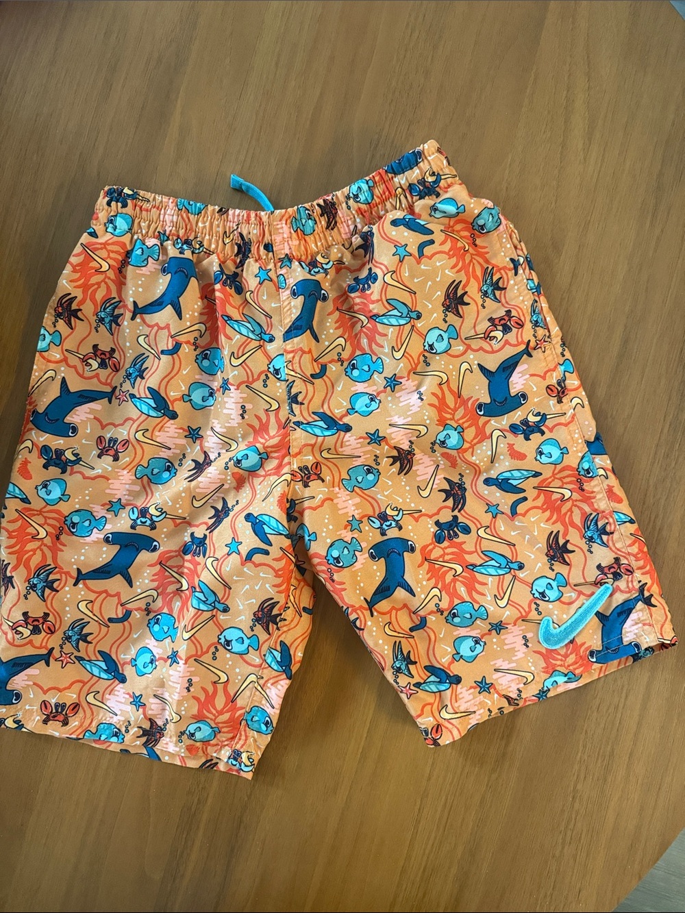 Nike Orange Swim Trunks with Blue Sea Creature Print. 7inch lined
